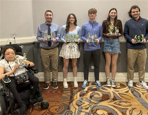 Ken-Ton student athletes pose with their awards following athletic seasons